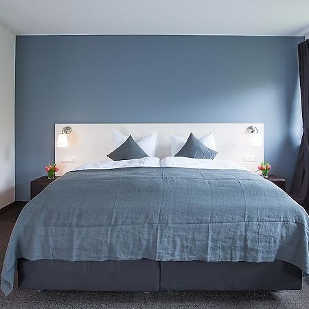Alpengluehen Smart Hotel Olching Quarto foto
